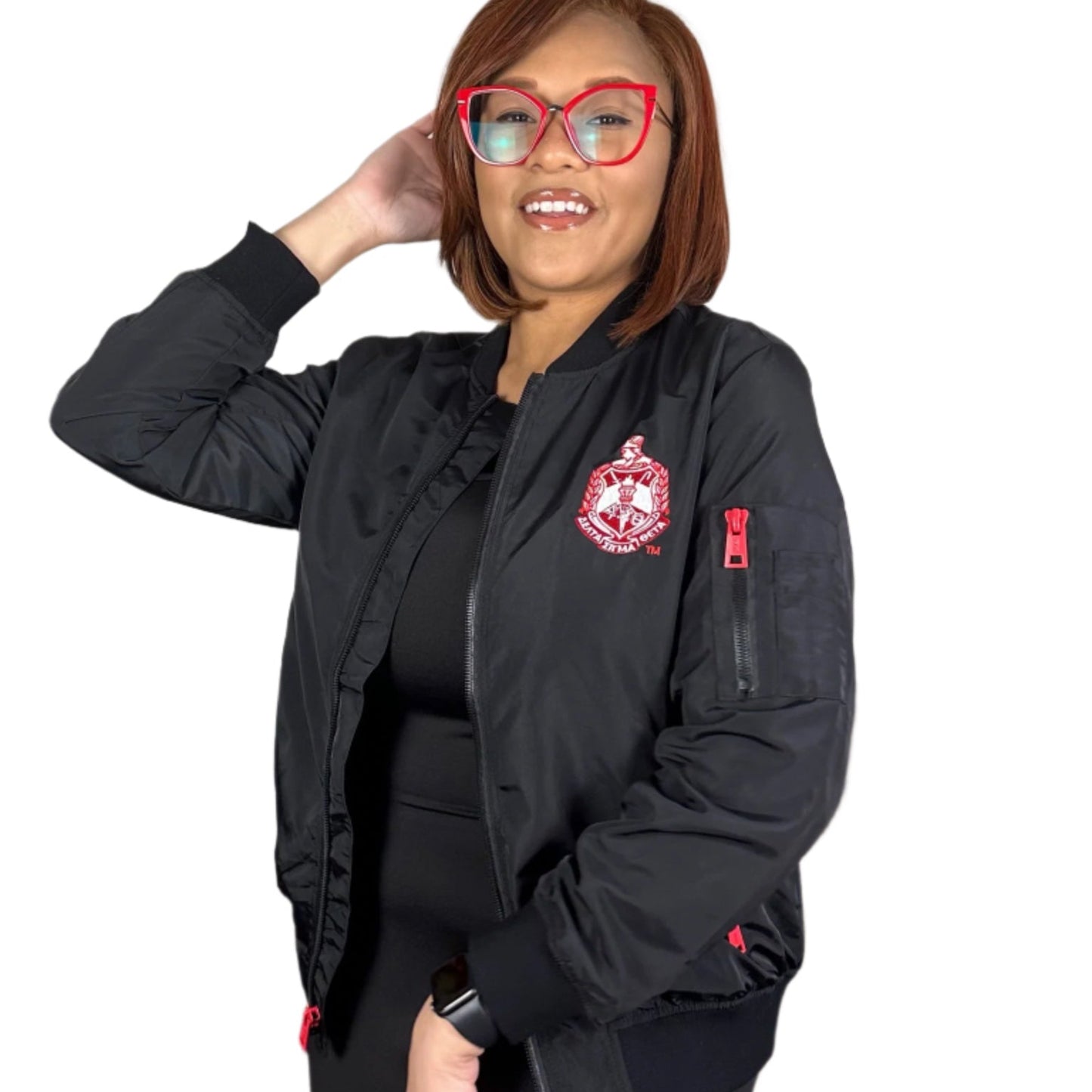 Woman wearing a black jacket with a Delta Sigma Theta Crest