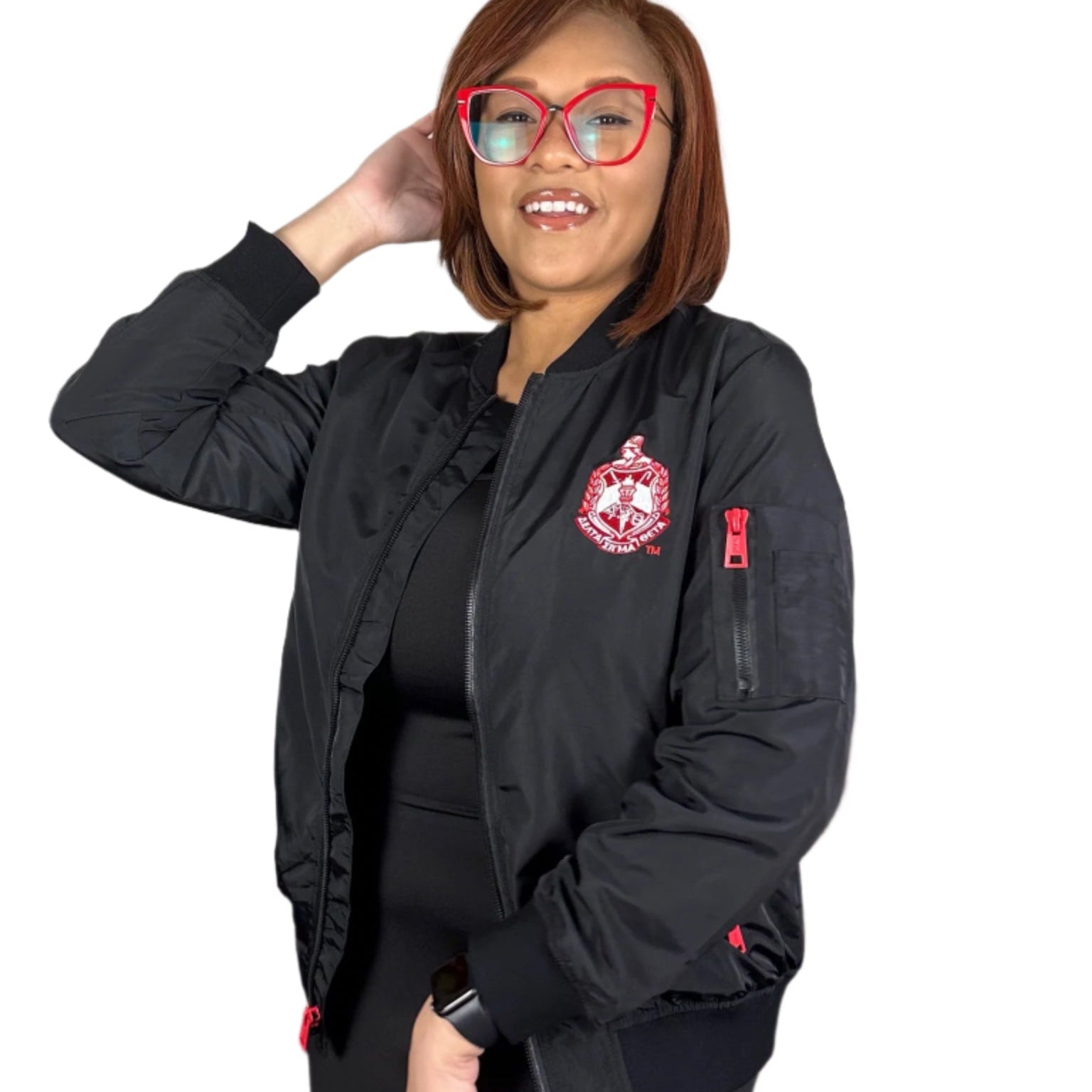 Woman wearing a black jacket with a Delta Sigma Theta Crest